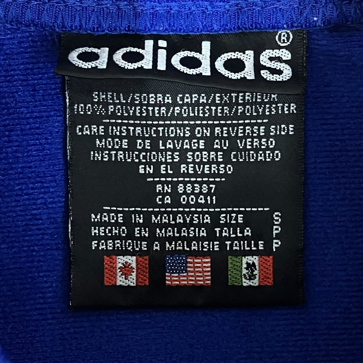 adidas(アディダス) 万国旗タグジャケット ブルー×ブラック サイズ S