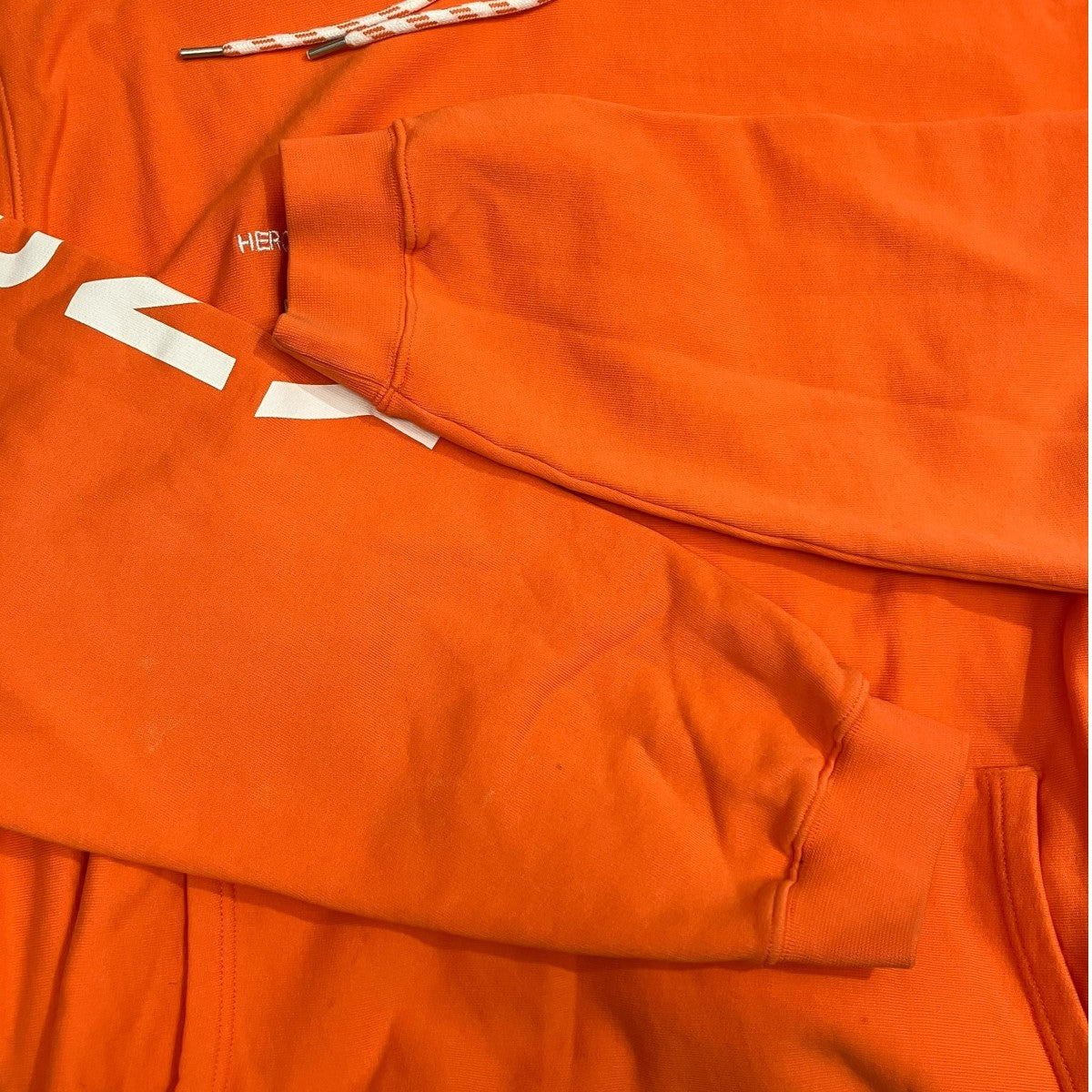 HERON PRESTON ヘロンプレストン × DSNY パーカー オレンジ HERON PRESTON(ヘロンプレストン) プルオーバーパーカー