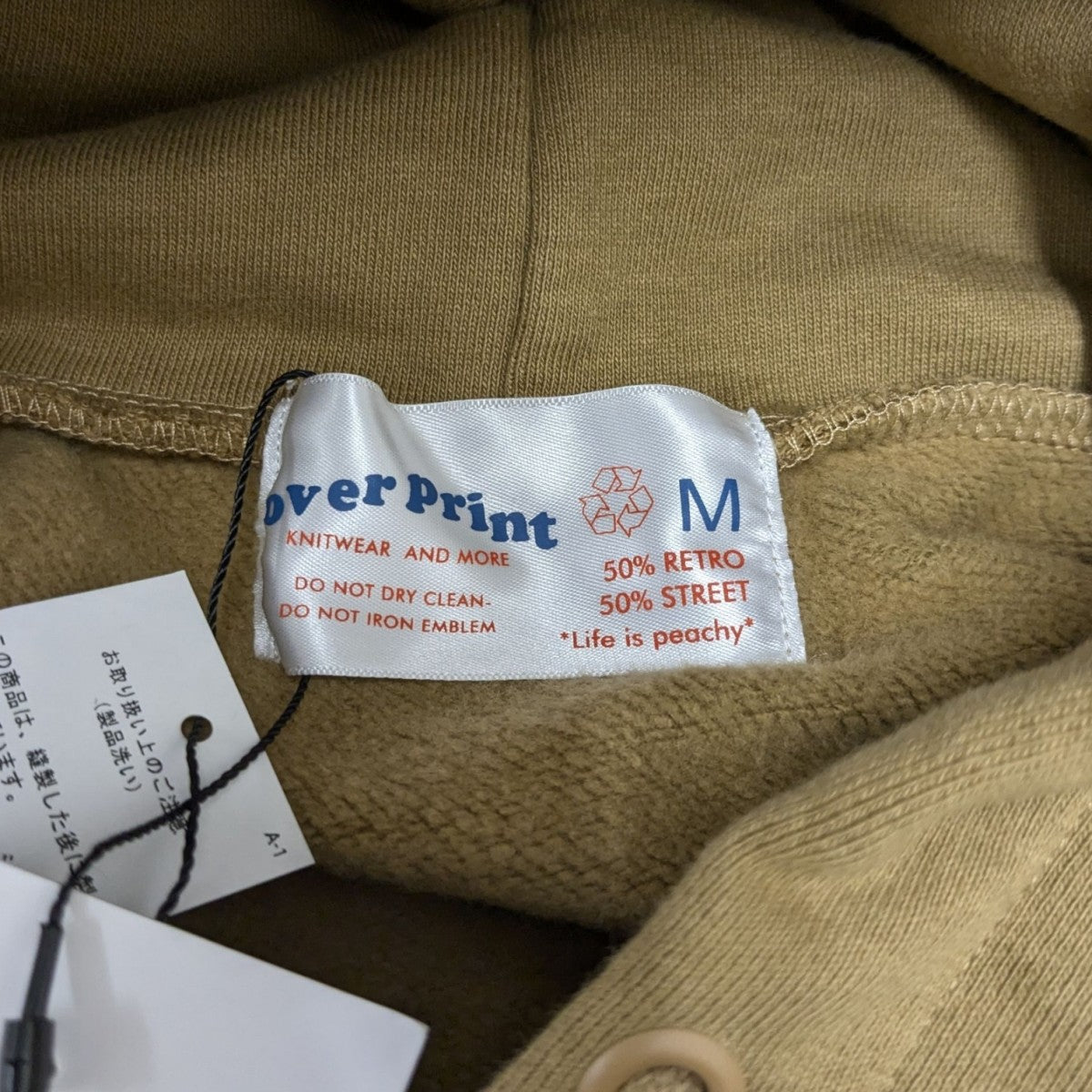 overprint(オーバープリント) 古塔つみ プルオーバーパーカー