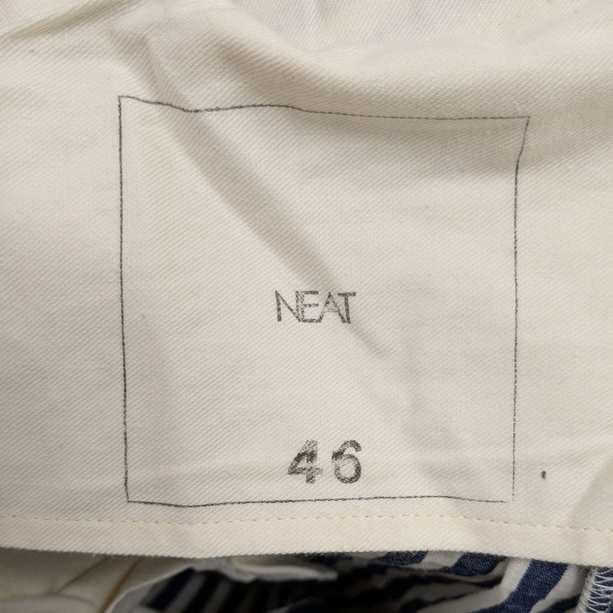 NEAT(ニート) テーパードシアサッカースラックス ネイビー