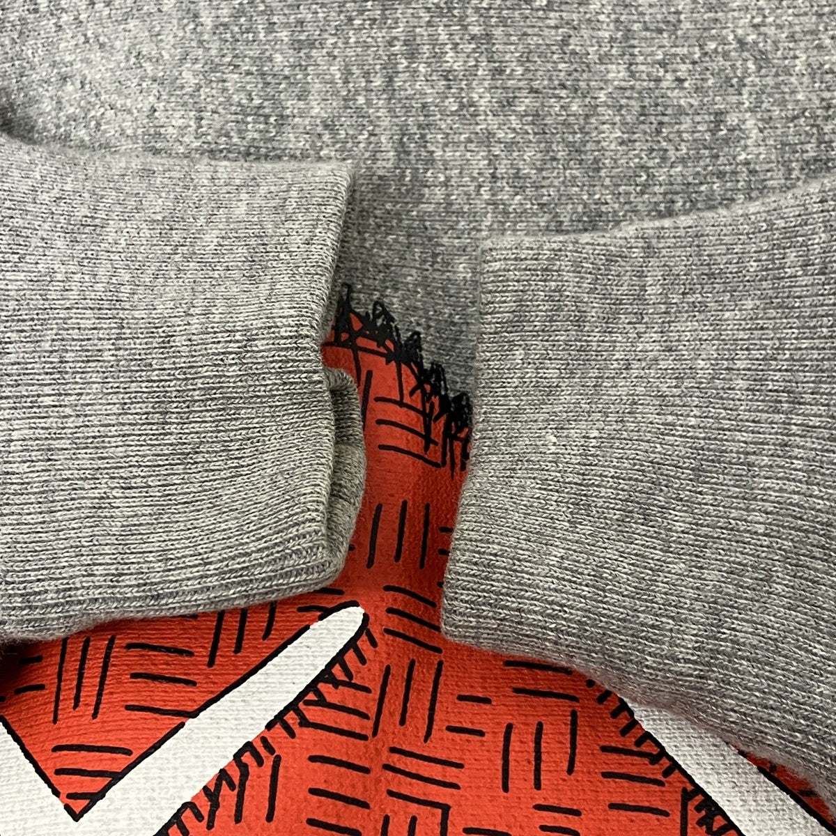 KAWS プリントパーカー