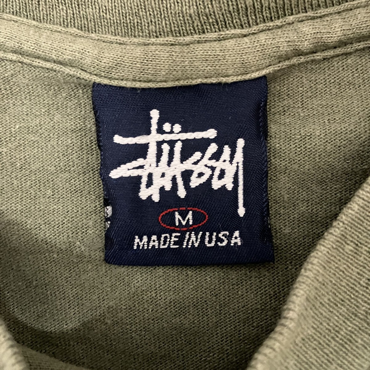 90s ステューシー Tシャツ stussy(ステューシー) 90s【WORLD TIME】半袖Tシャツ オリーブ サイズ