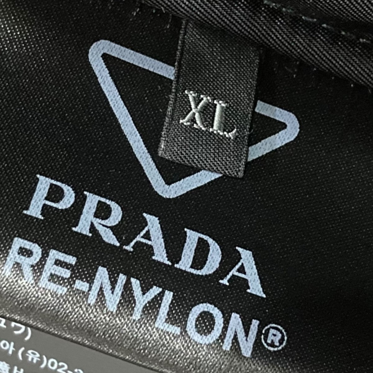 22AWリサイクルポリアミドバックプレート総柄ロングコートSGC091 S222