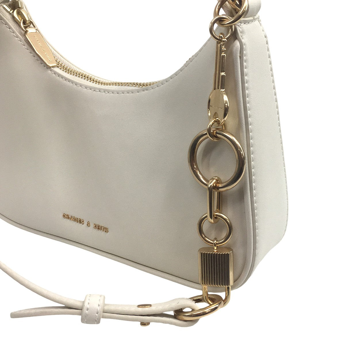 CHARLES ＆ KEITH 古着・中古 チャールズアンドキース)の23AW Cream Lane Lock ＆ Key Chain Handle Trapeze Bag ロック＆キーチェーン ハンドルトラペーズバッグ ショルダーバッグです。