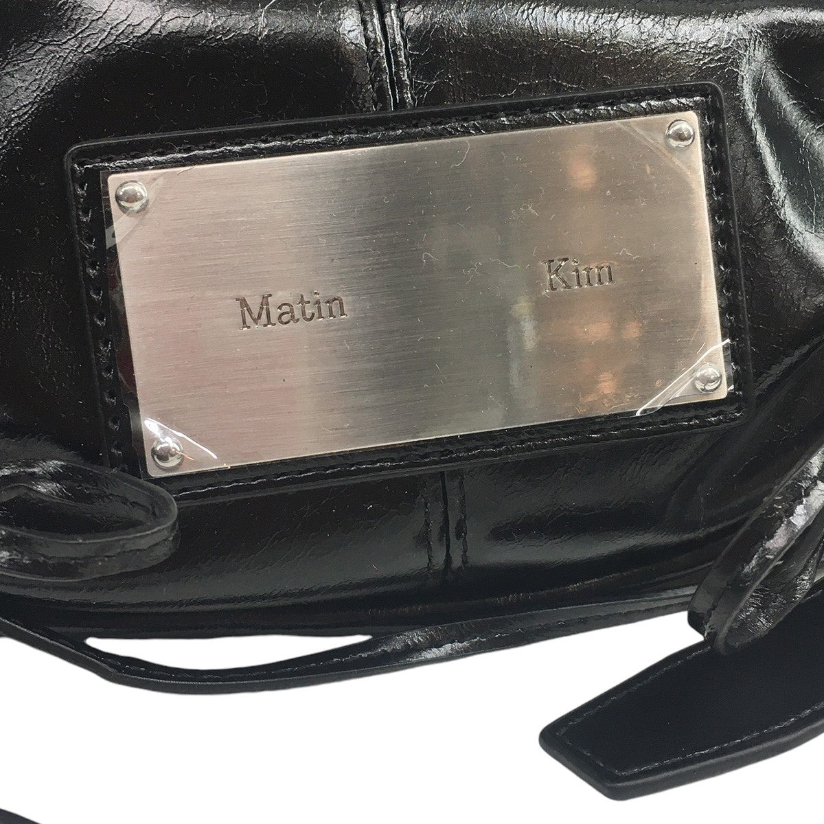 MATIN KIM 古着・中古 マーティンキムのHALF SHIRRING RIBBON ROUND BAG ハーフ シリング リボン ラウンド ロゴ プレート バッグ 鞄です。