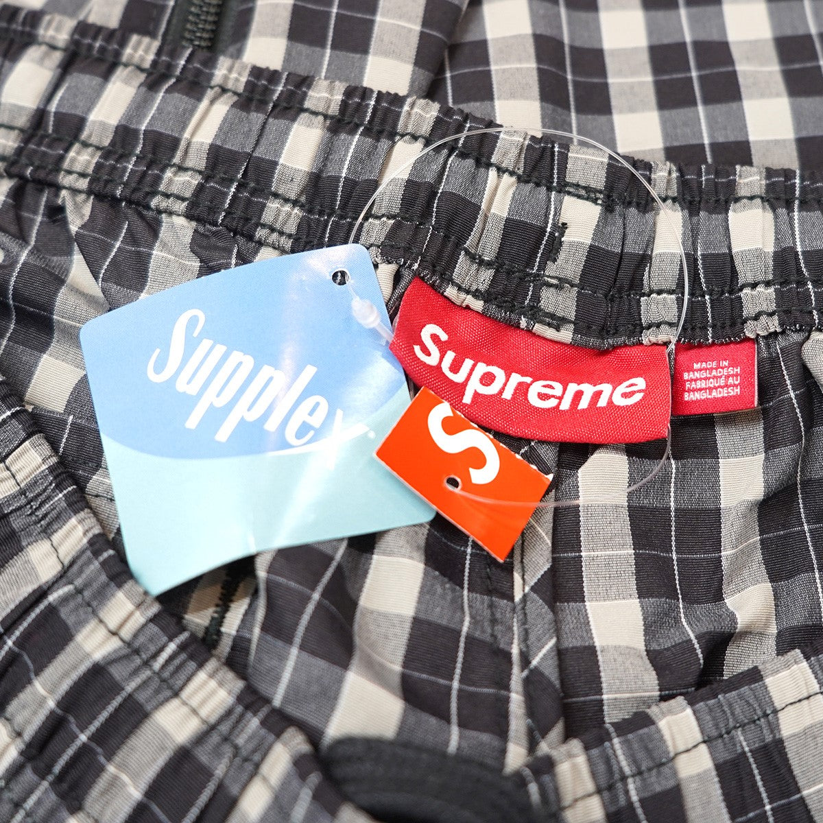 25AW Plaid Warm Up Pant サプレックス Supplex  ナイロンプレイド チェック サイド ジップ ロゴ刺繍 トラック ウォームアップ イージー パンツ