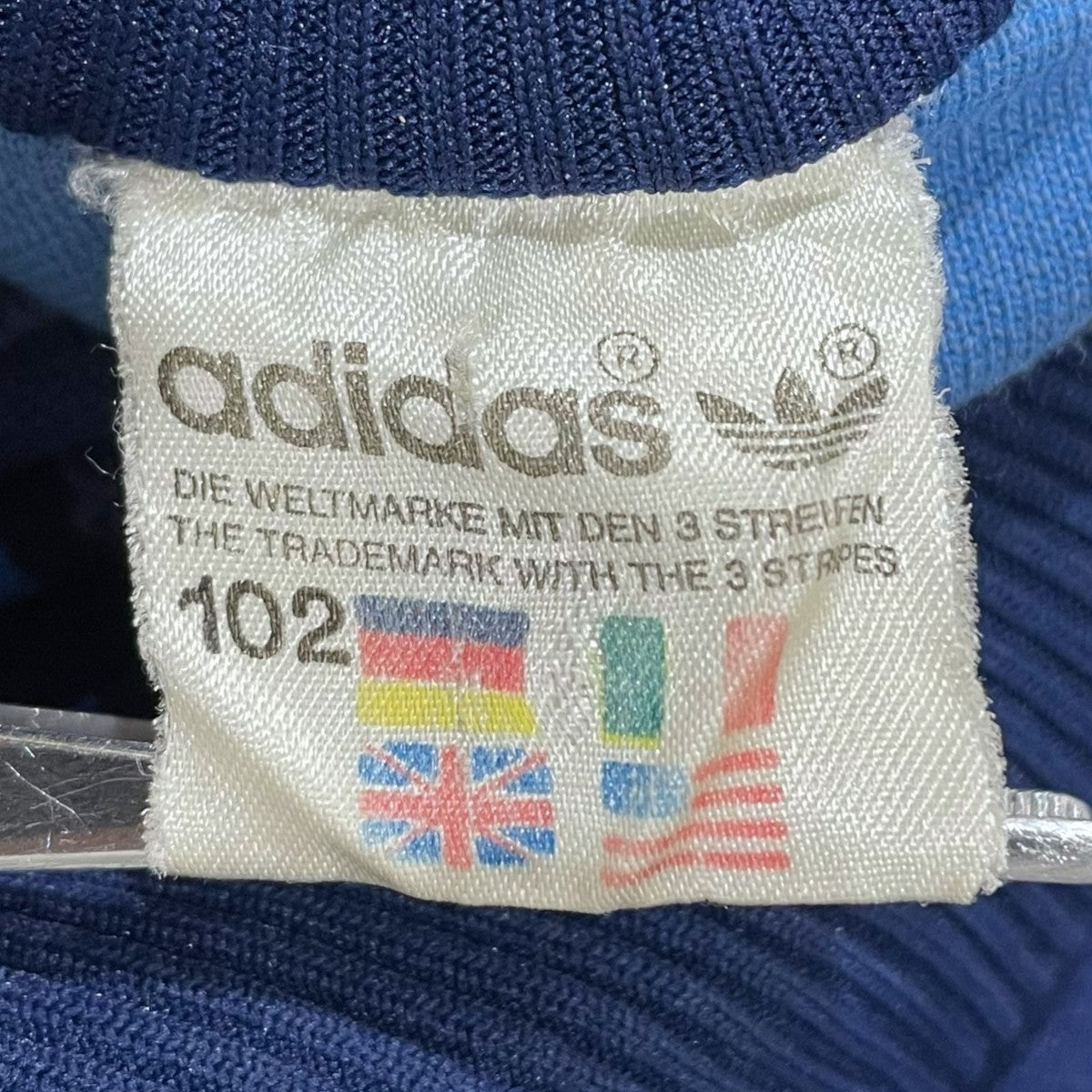 adidas(アディダス) トラックジャケット 万国旗タグ ブルー・ネイビー