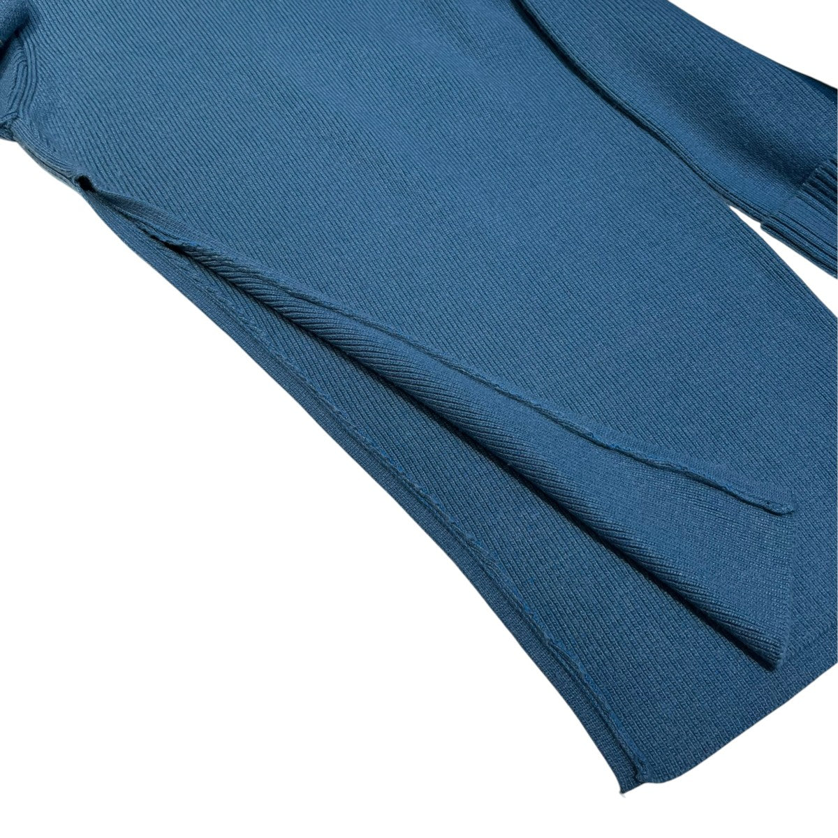 SLANT CUT KNIT TOPS